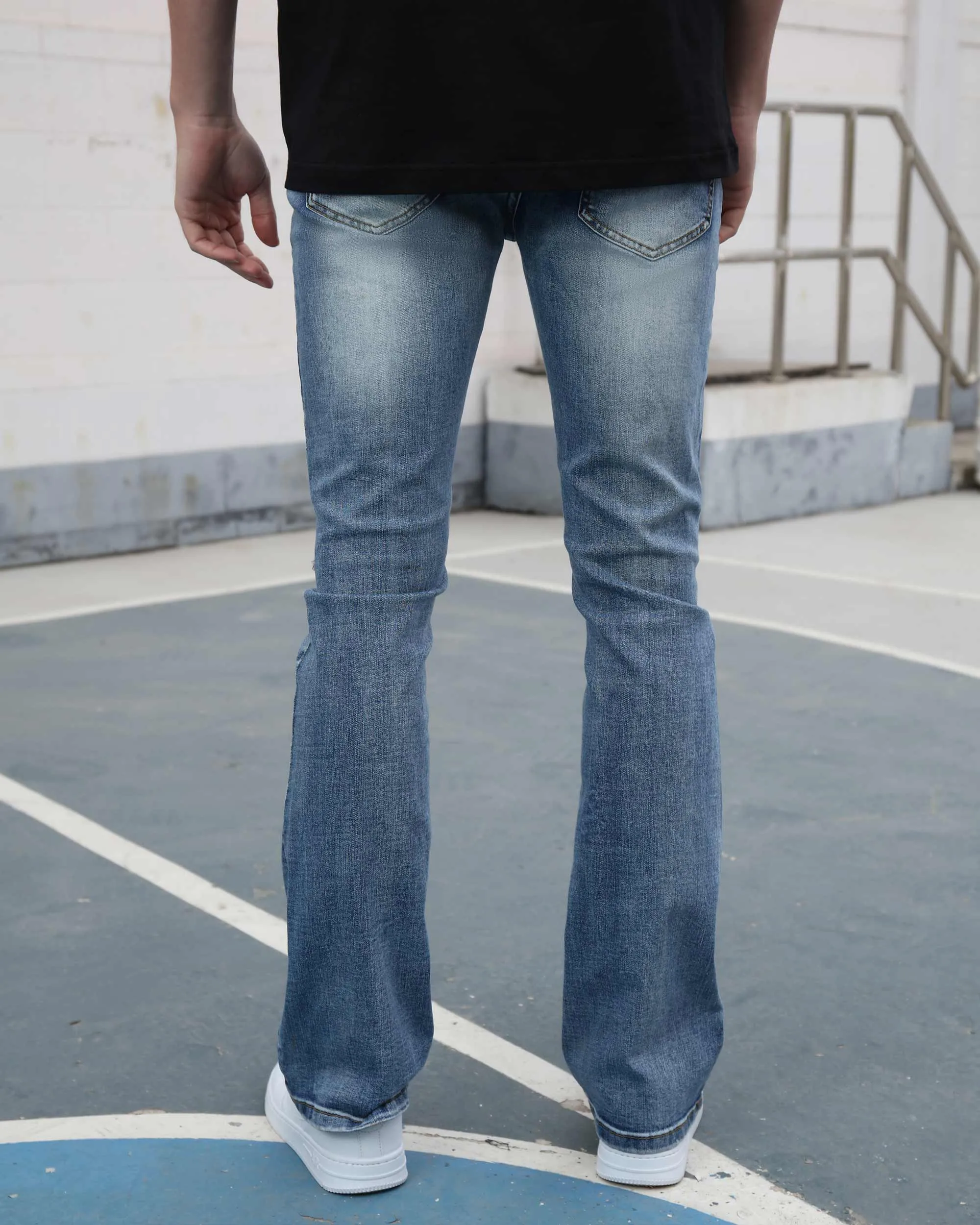 Medium Wash Blue Jeans with Ripped Text