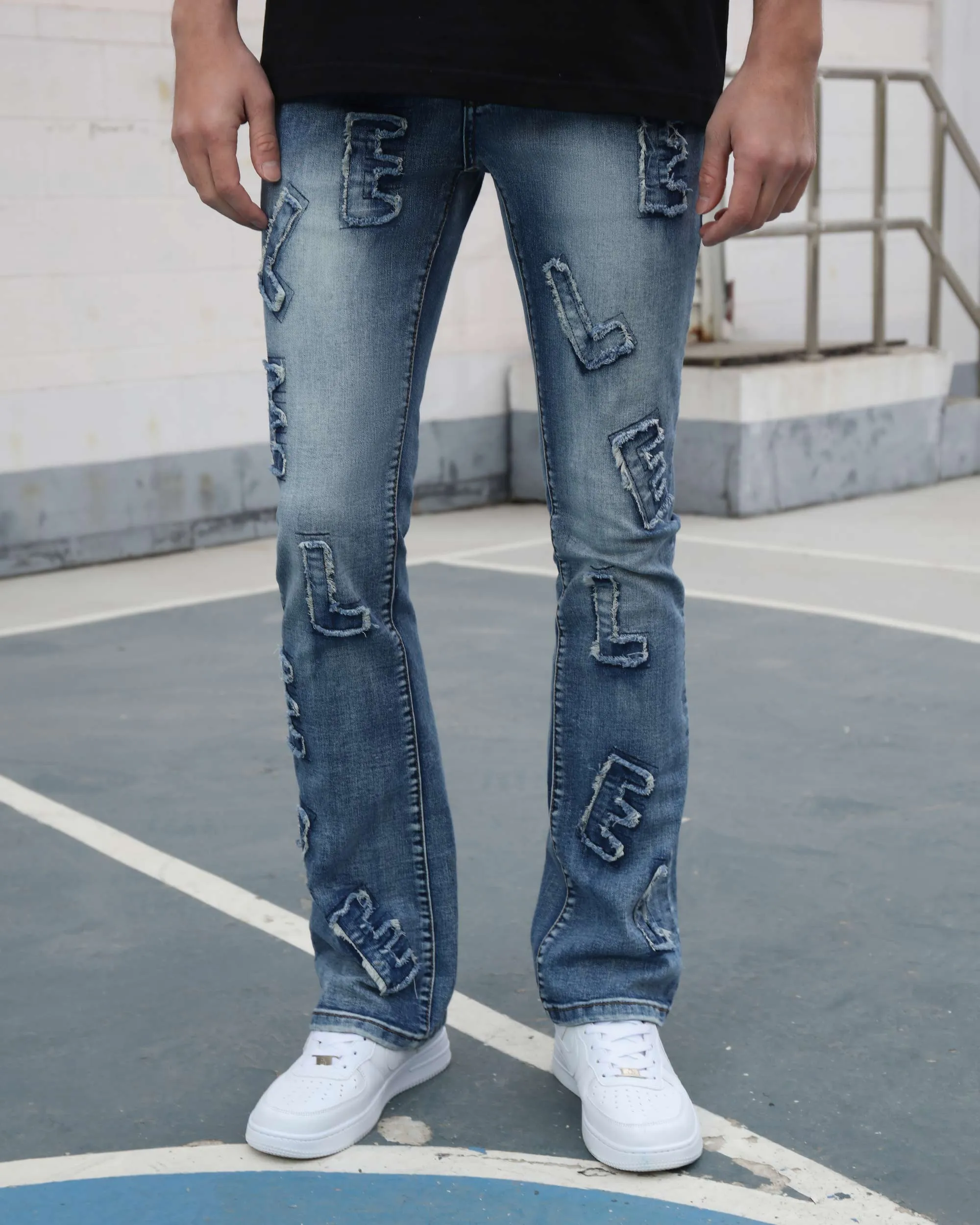 Medium Wash Blue Jeans with Ripped Text