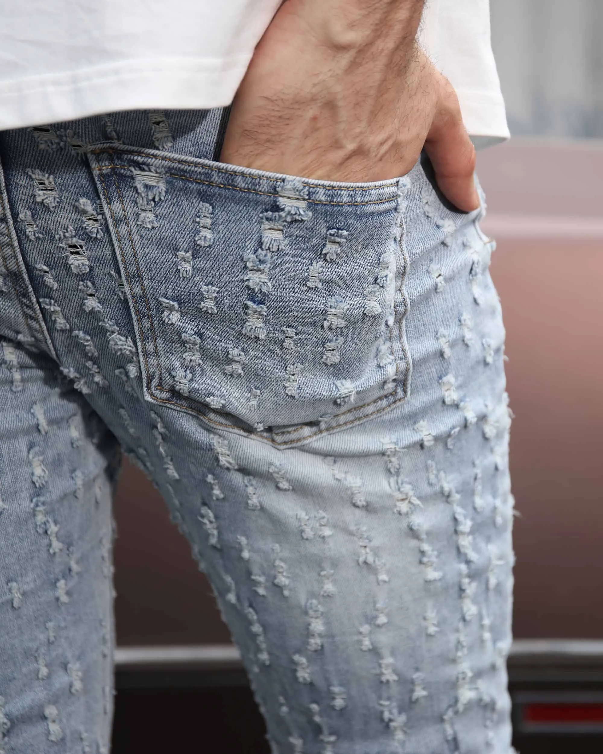 Slim Fit Light Wash Blue Ripped Jeans with Small Rips