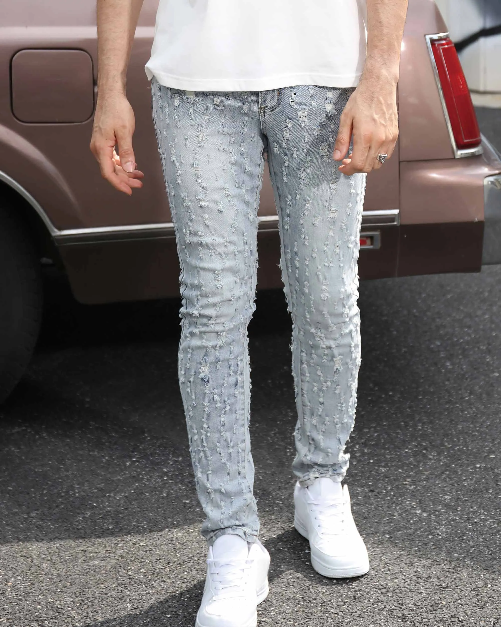 Slim Fit Light Wash Blue Ripped Jeans with Small Rips