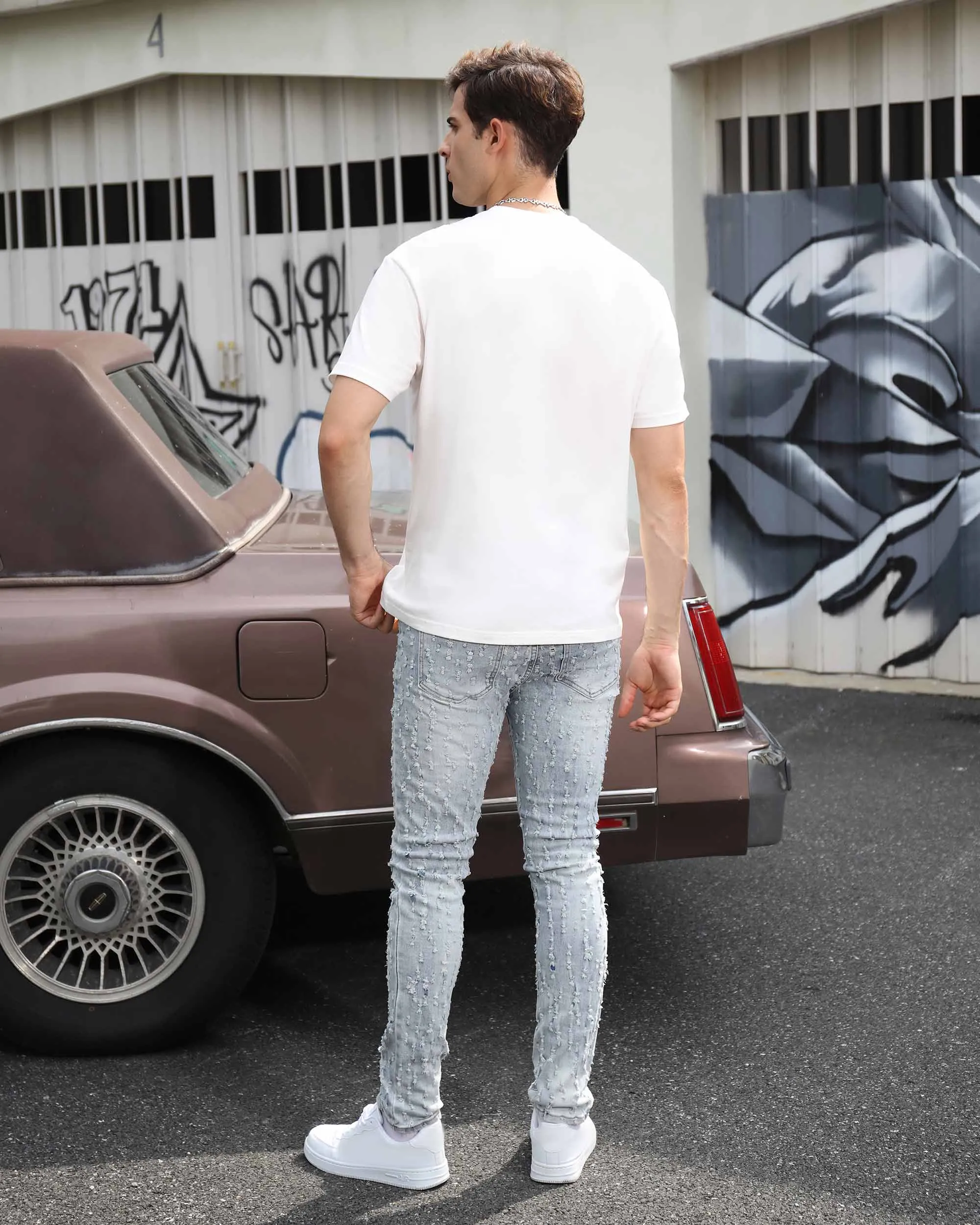 Slim Fit Light Wash Blue Ripped Jeans with Small Rips