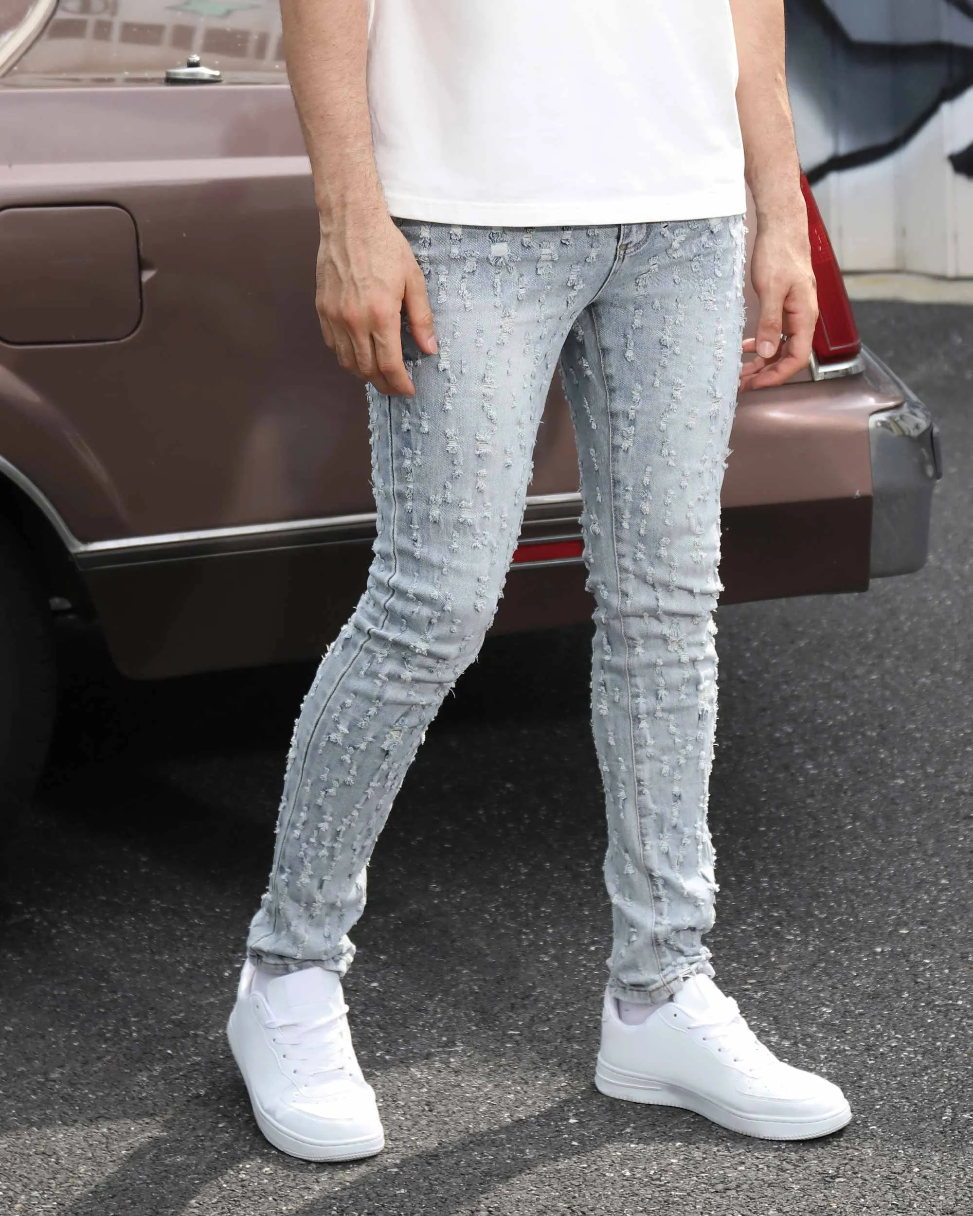 Slim Fit Light Wash Blue Ripped Jeans with Small Rips