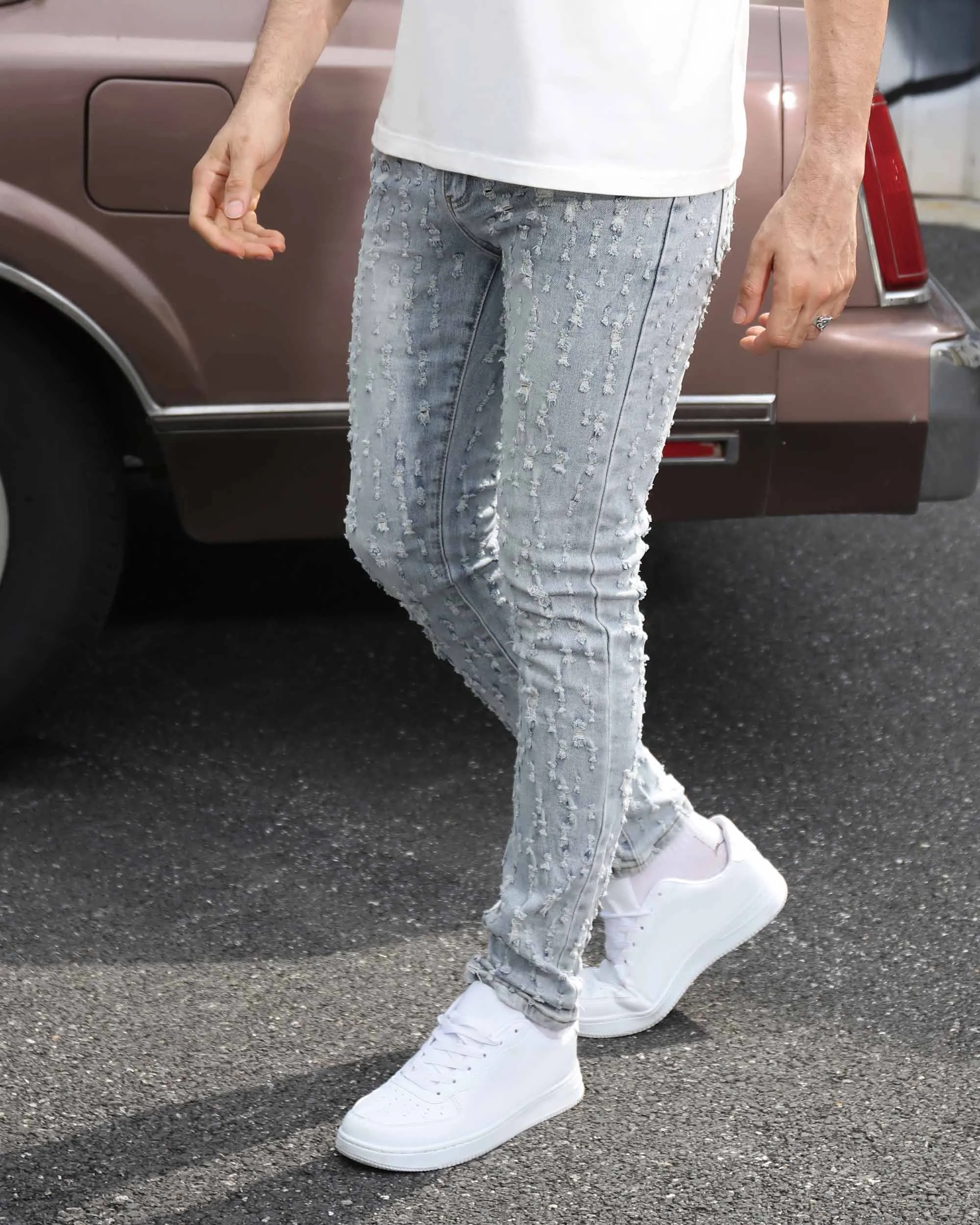 Slim Fit Light Wash Blue Ripped Jeans with Small Rips