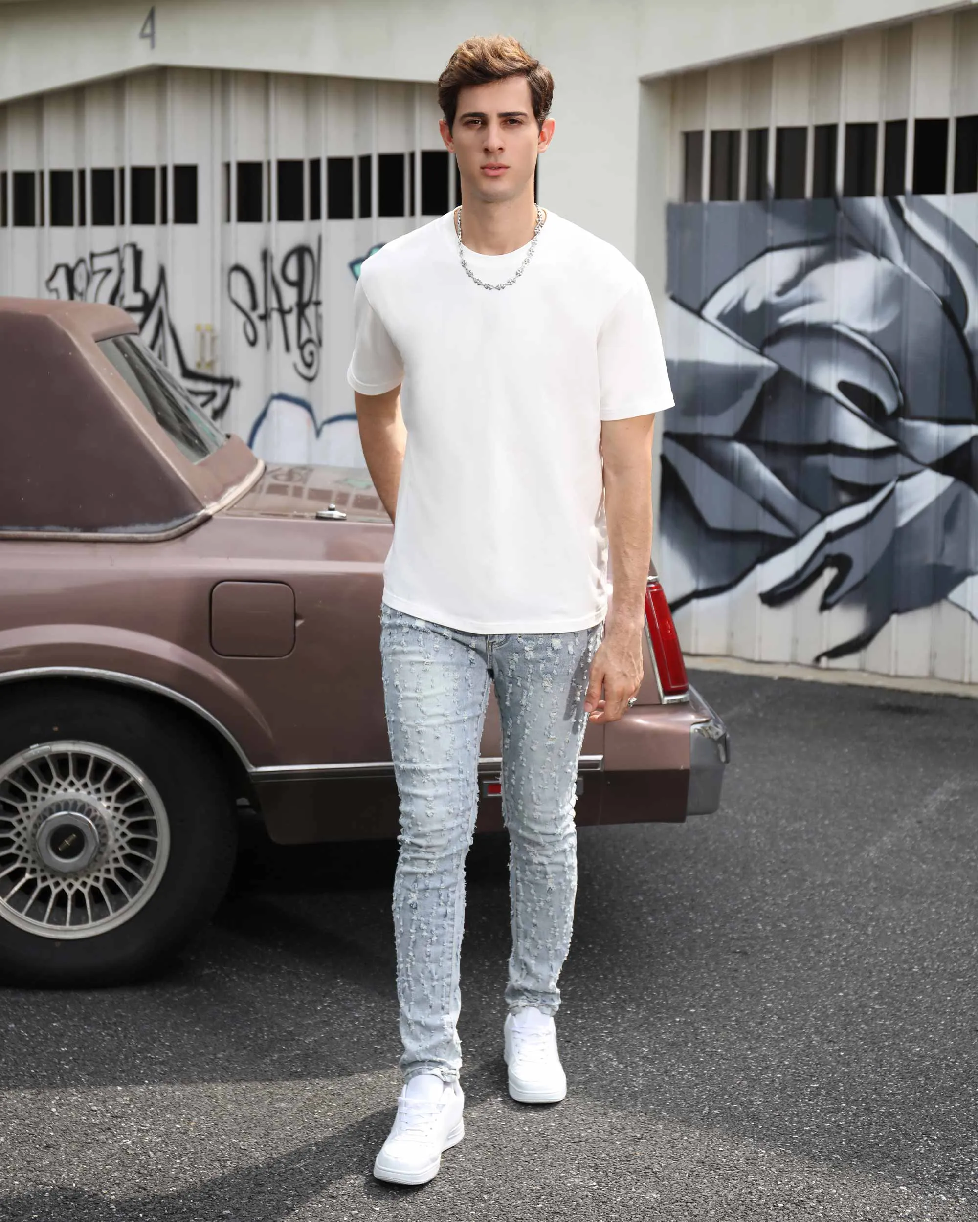 Slim Fit Light Wash Blue Ripped Jeans with Small Rips